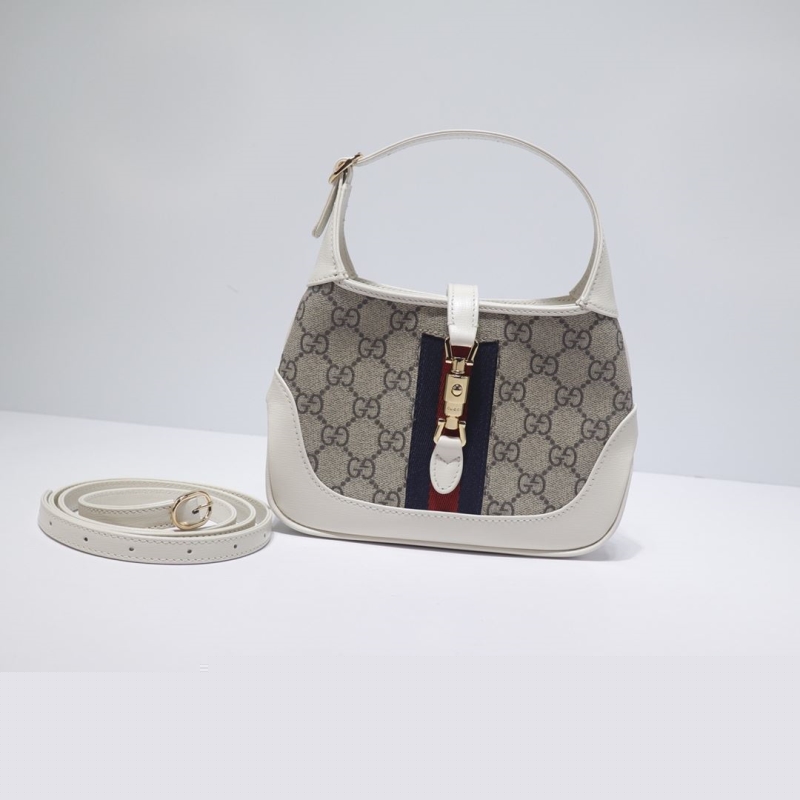 G*u*i top handle bags